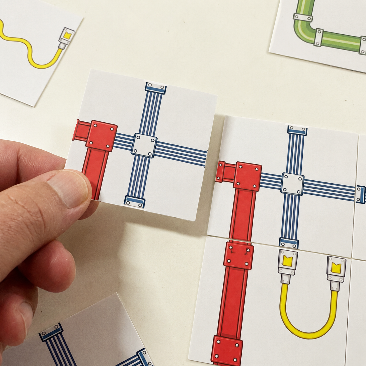 Circuit Sibz game tiles forming an interconnected system with red Beam, yellow Wire, blue Trace, and green Pipe pathways.